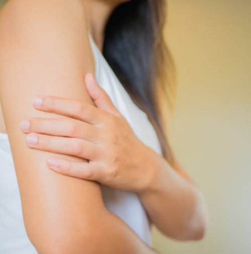 Closeup female’s arm. Arm pain and injury. Health care and medical concept. Closeup female's arm. Arm pain and injury. Health care and medical concept.